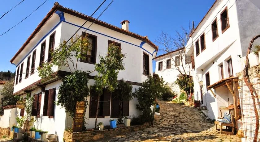 Traditional white facade of Kırkınca hotel in Şirince